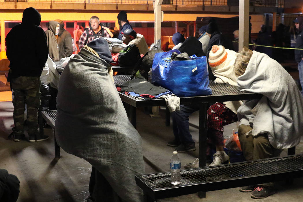 Clients try to keep warm at Courtyard Homeless Resource Center on Thursday, Oct. 31, 2019, in L ...