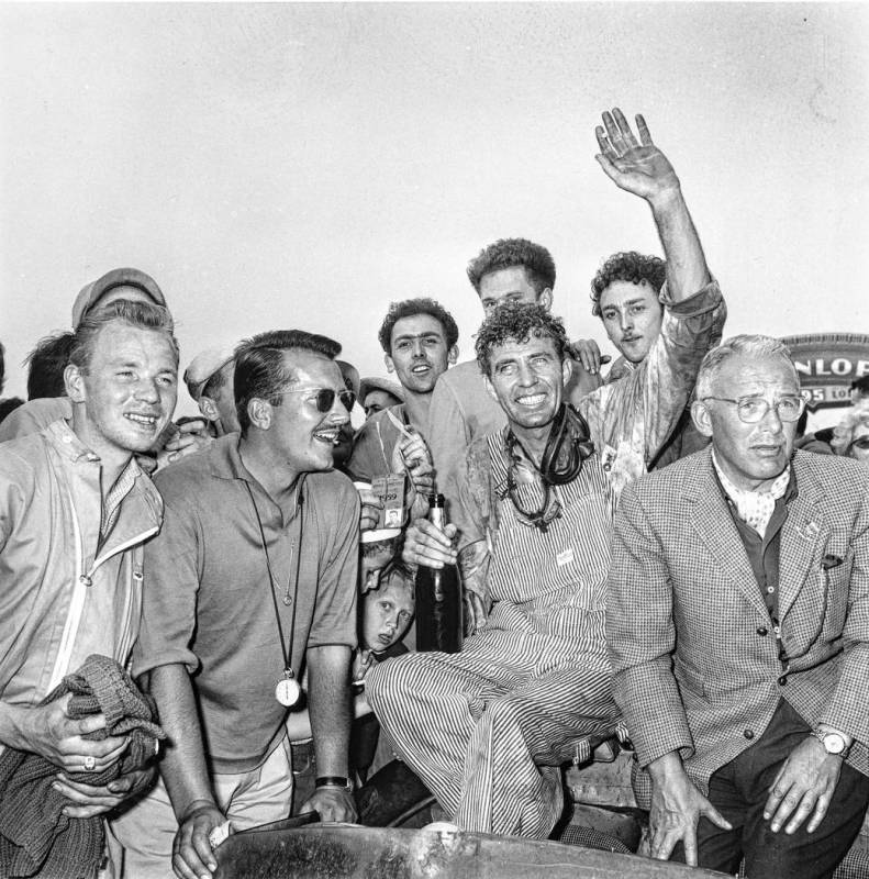 Race car driver Carroll Shelby, of Dallas, Texas, is surrounded by fans after winning the 24-ho ...