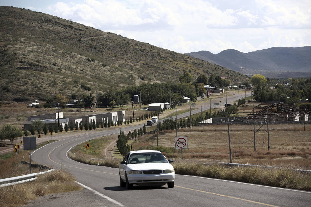 A car passes through Colonia LeBaron, one of many locations where the extended LeBaron family l ...