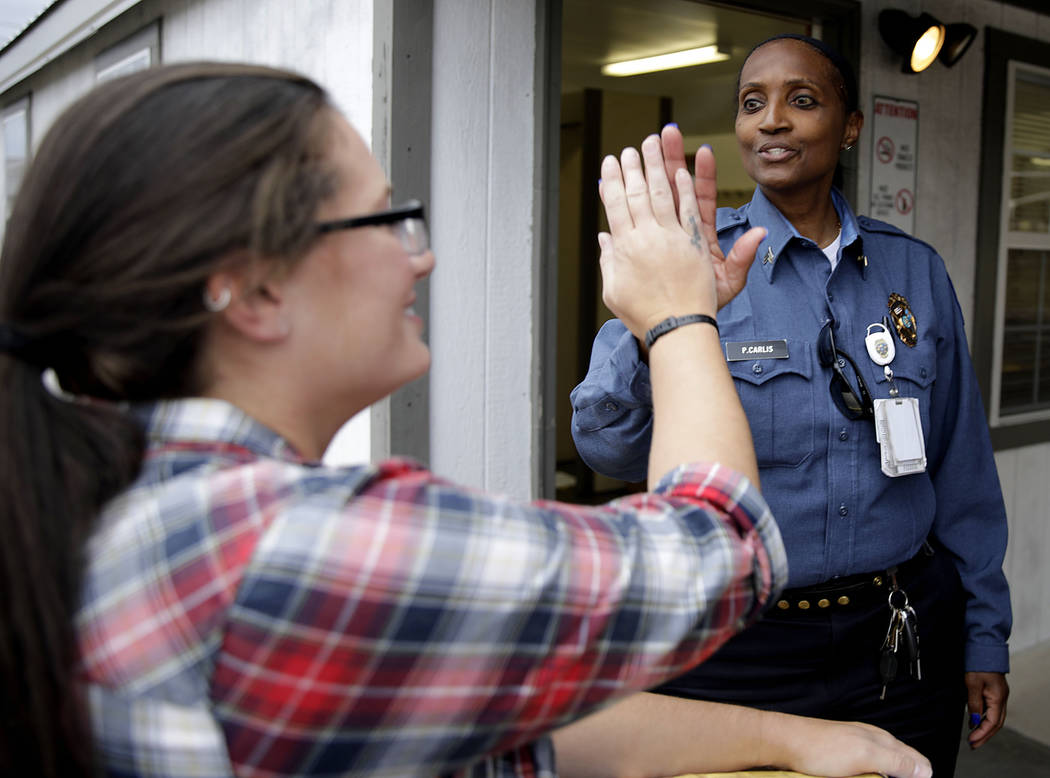 Danni Roberts is given a high five from Correctional officer Sgt. Pamela Carlis as she leaves D ...