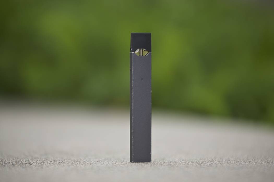 An April 16, 2019, file photo, shows a Juul vape pen in Vancouver, Wash. New research released ...