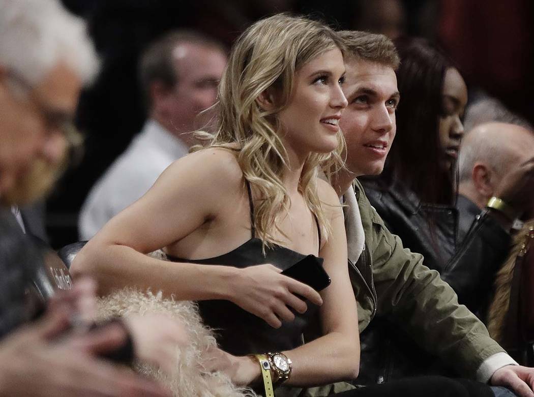 Genie Bouchard, left, sits with her blind date, John Goehrke, right, during the first half of a ...