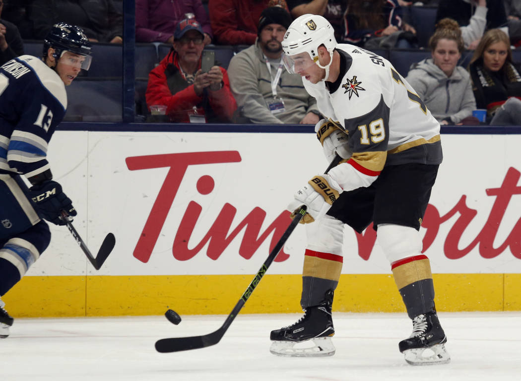 Vegas Golden Knights forward Reilly Smith, right, controls the puck in front of Columbus Blue J ...