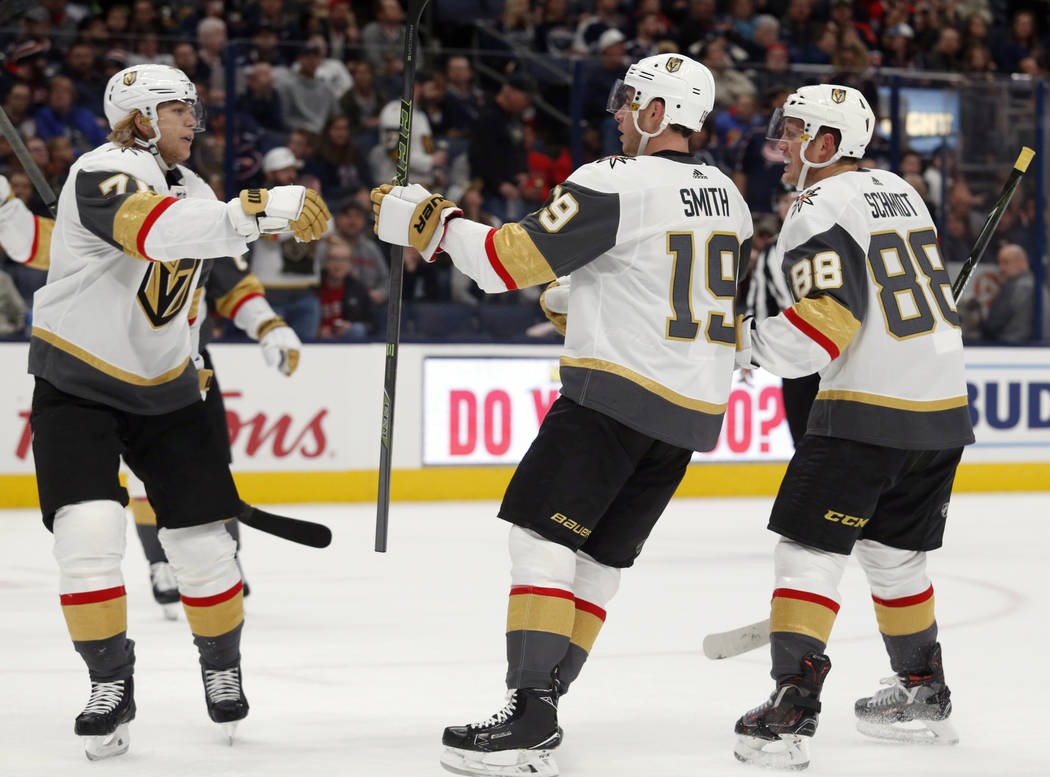 Vegas Golden Knights forward Reilly Smith, center, celebrates his goal against the Columbus Blu ...