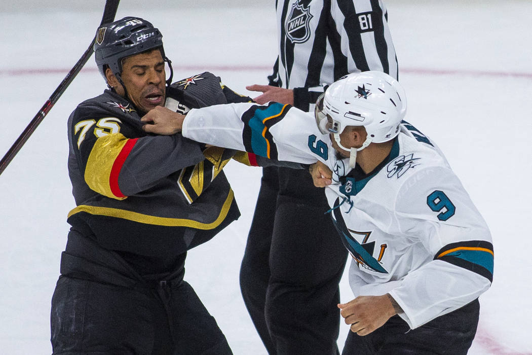 Golden Knights right wing Ryan Reaves (75) fights with San Jose Sharks left wing Evander Kane ( ...