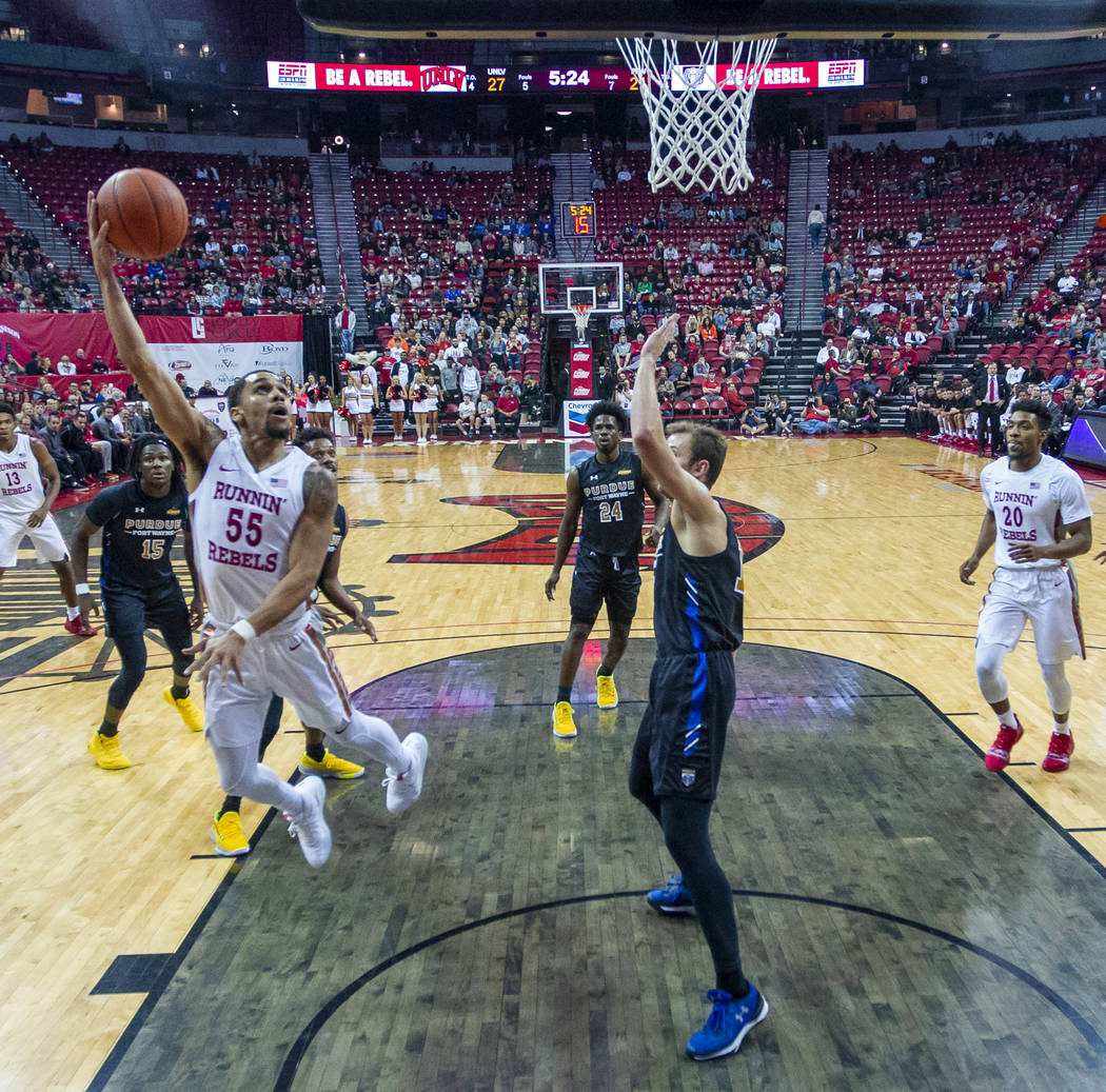 UNLV Rebels guard Elijah Mitrou-Long (55) gets off a hook shot over Purdue Fort Wayne forward M ...