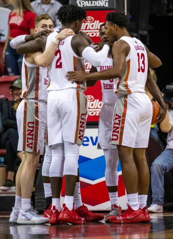 UNLV Rebels players huddle after a foul call versus Purdue Fort Wayne during the first half of ...