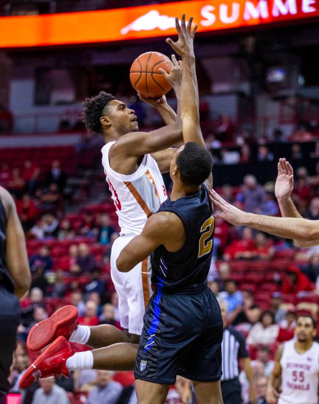 UNLV Rebels guard Bryce Hamilton (13) looks to get off a shot over Purdue Fort Wayne guard Bria ...