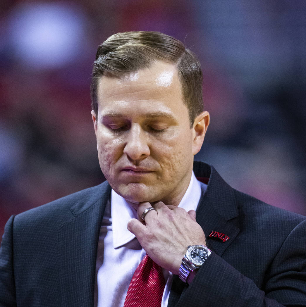 UNLV Rebels head coach T.J. Otzelberger adjust his collar versus Purdue Fort Wayne during the s ...