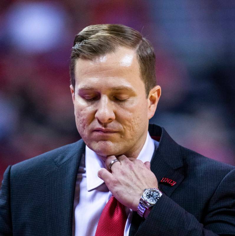 UNLV Rebels head coach T.J. Otzelberger adjust his collar versus Purdue Fort Wayne during the s ...