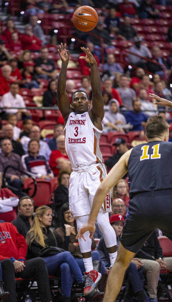 UNLV Rebels guard Amauri Hardy (3) elevates for a three-point basket over Purdue Fort Wayne for ...