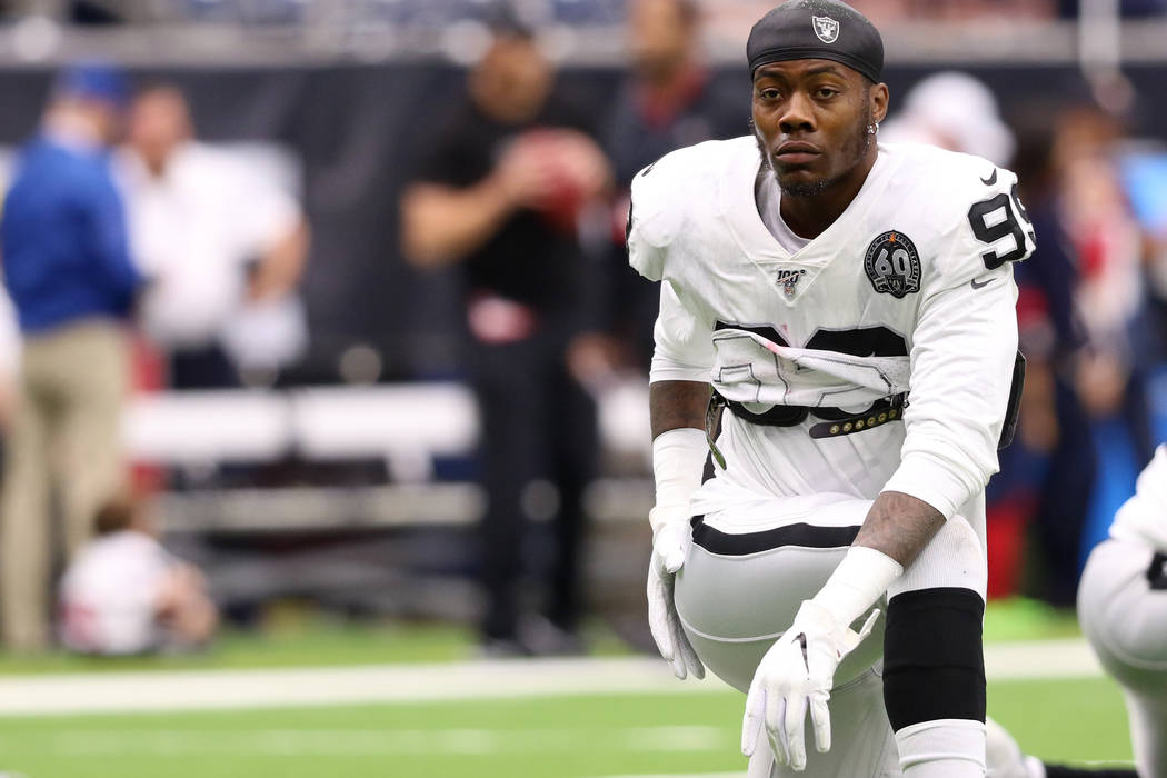 Oakland Raiders defensive end Arden Key (99) stretches before an NFL game against the Houston T ...