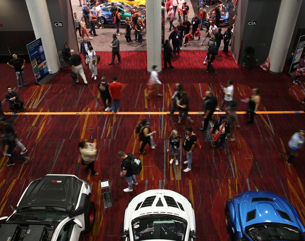 People attend the SEMA show at the Las Vegas Convention Center in Las Vegas, Tuesday, Nov. 5, 2 ...