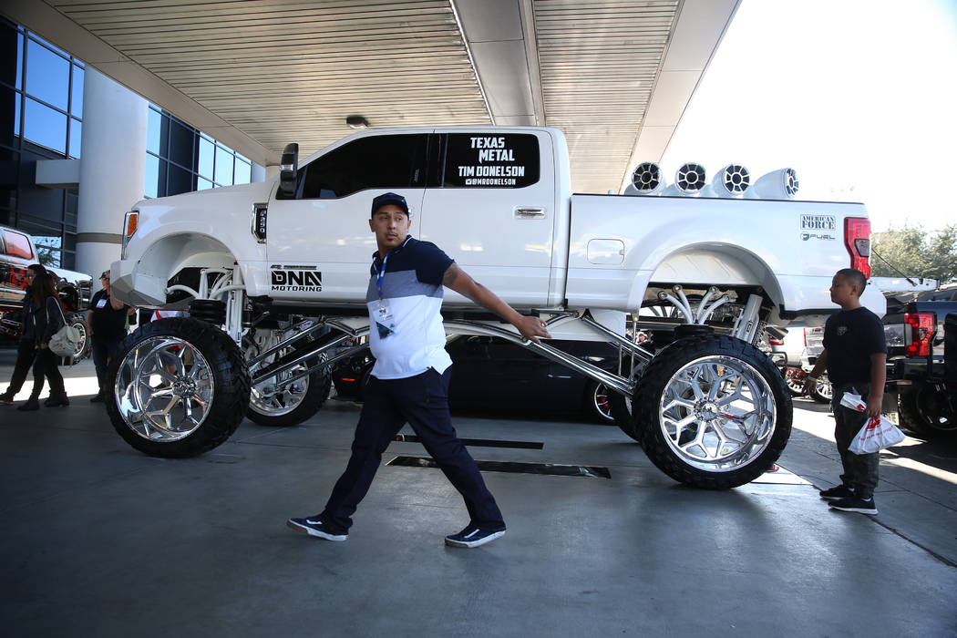 People attend the SEMA show at the Las Vegas Convention Center in Las Vegas, Tuesday, Nov. 5, 2 ...