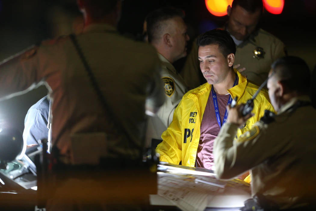 Las Vegas police officers respond Tuesday, Nov. 5, 2019, to a fatal shooting near Jones Bouleva ...