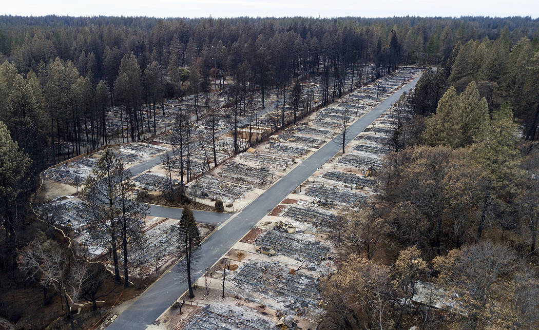 FILE-In this Monday, Dec. 3, 2018, homes are seen leveled by the Camp Fire line the Ridgewood M ...