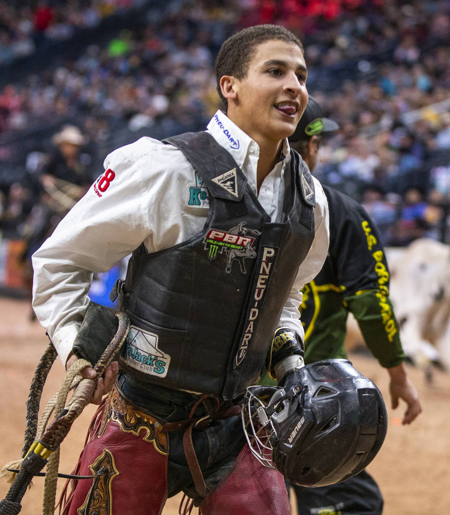Dalton Kasel is pleased with his ride on Too Dirty during the PBR World Finals at T-Mobile Aren ...