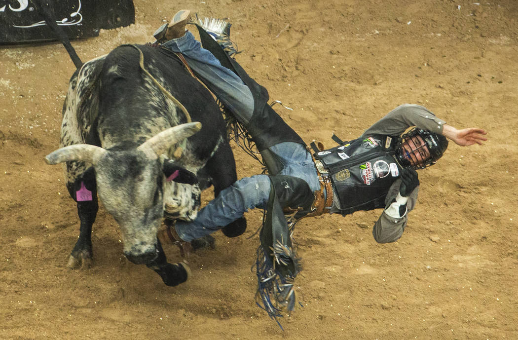 Jared Parsonage comes off sideways from Good Night Robicheaux during the PBR World Finals at T- ...