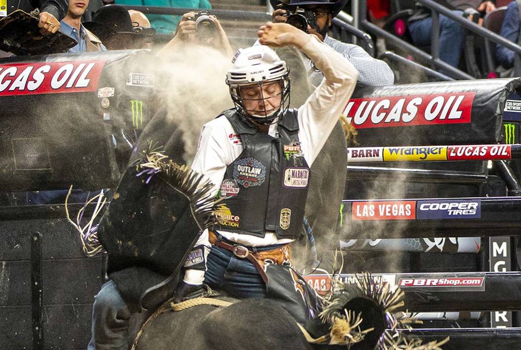 Mason Taylor rides El Big Bad for just under eight seconds during the PBR World Finals at T-Mob ...