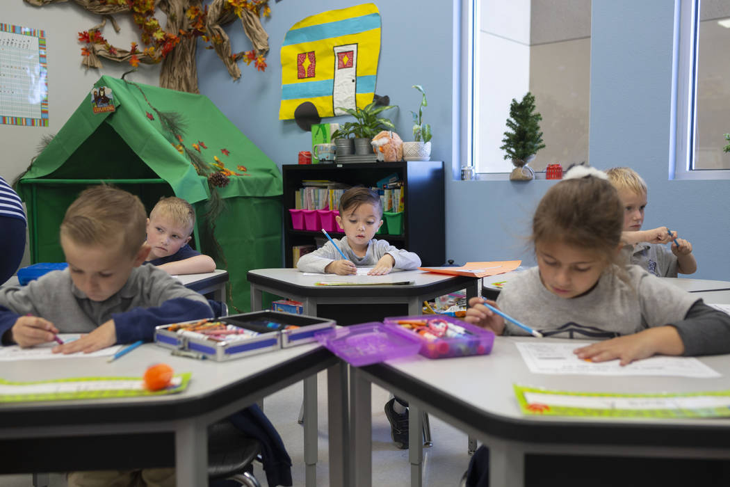 Kindergarten students work on a reading assignment at Pinecrest Academy, Nevada's newest campus ...