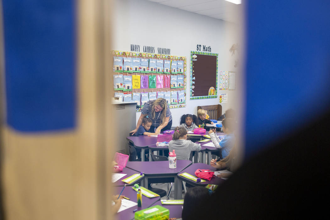 Mrs. Carrie Cox works with her kindergarten students Pinecrest Academy, Nevada's newest campus ...