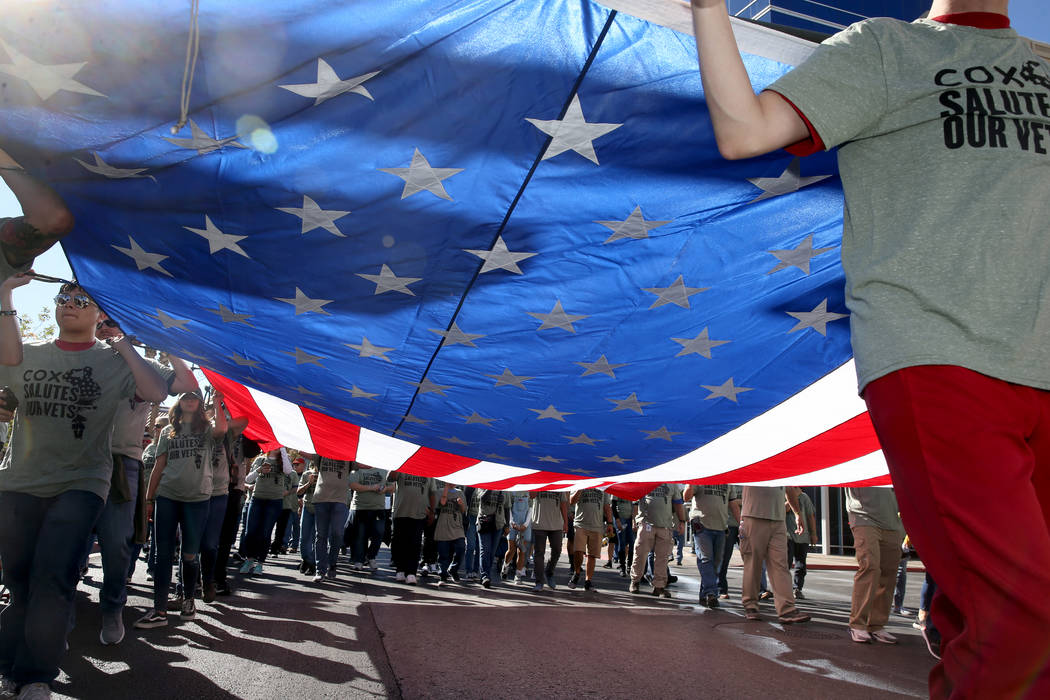 The Cox Communications entry in the Veterans Day Parade in downtown Las Vegas Monday, Nov. 11, ...