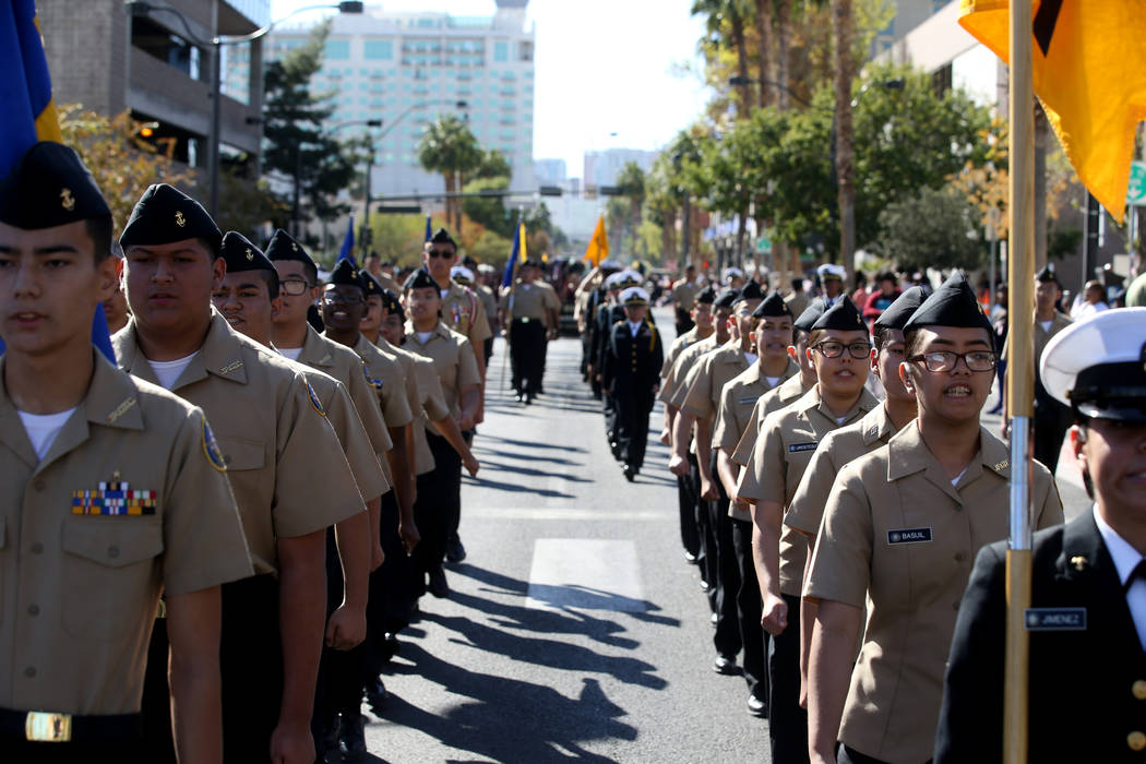 Centennial High School Navy Junior ROTC marches in the Veterans Day Parade in downtown Las Vega ...