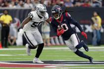 Houston Texans wide receiver DeAndre Hopkins (10) runs around Oakland Raiders linebacker Nichol ...