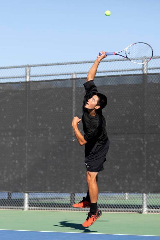 Palo Verde's Axel Botticelli jumps to serve against Coronado's Jason Elliot on Wednesday, Nov. ...