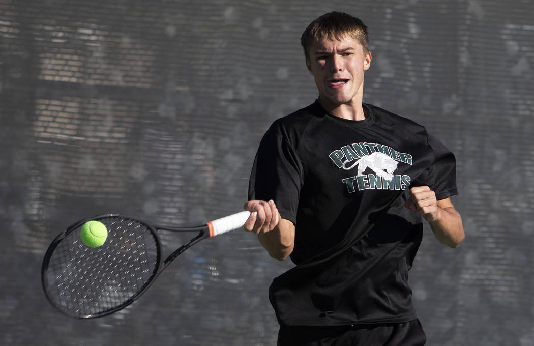 Coronado's Ian Hawkes hits the ball to Palo Verde opponents Tyler Juhasz and Ryan Jensen on Wed ...