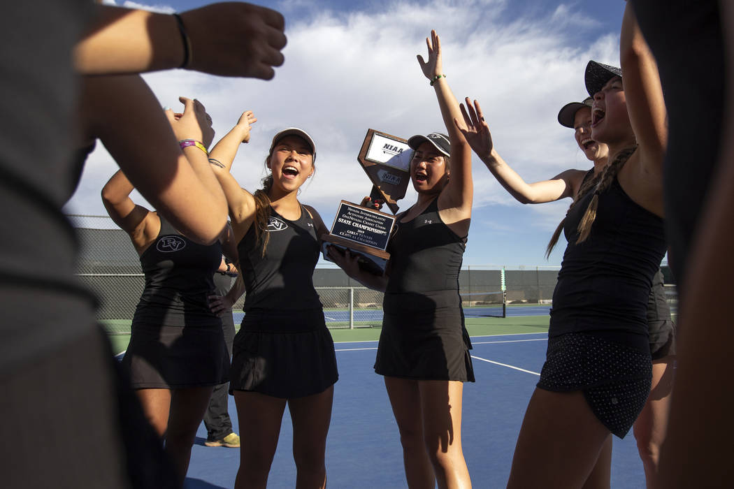 Palo Verde girls varsity tennis captains Devon Yamane, left, and Caroline Hsu, right, thank the ...