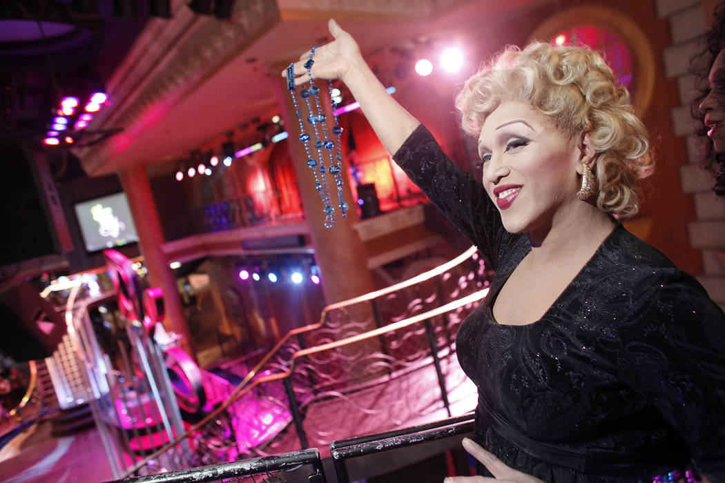 Joseph Santellana of "Divas Las Vegas" throws beads from a float during a special "Show in the ...