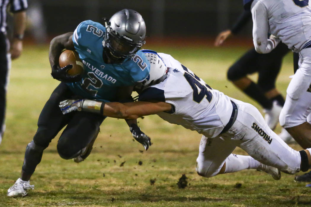 Foothill's Colter Mckee (45) stops Silverado's Aginae Cunningham (2) during the second half of ...