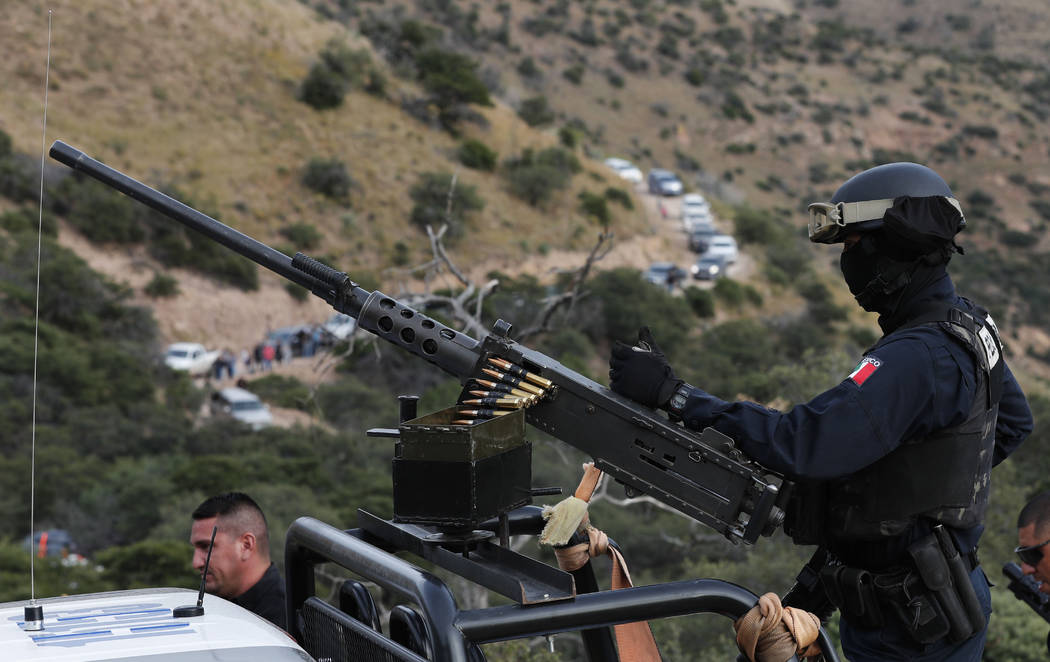 Escorted by heavily armed Mexican authorities, a caravan of friends and relatives of the LeBaro ...