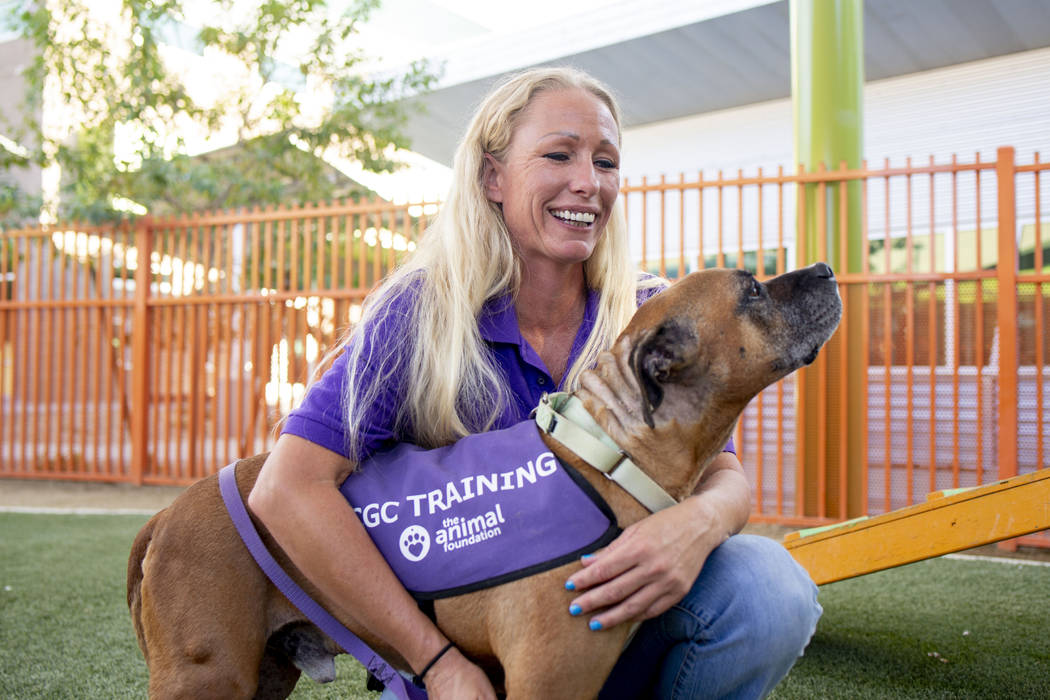 Nicole Fox, an enrichment specialist for the Animal Foundation, trains Louie, an eight-year-old ...