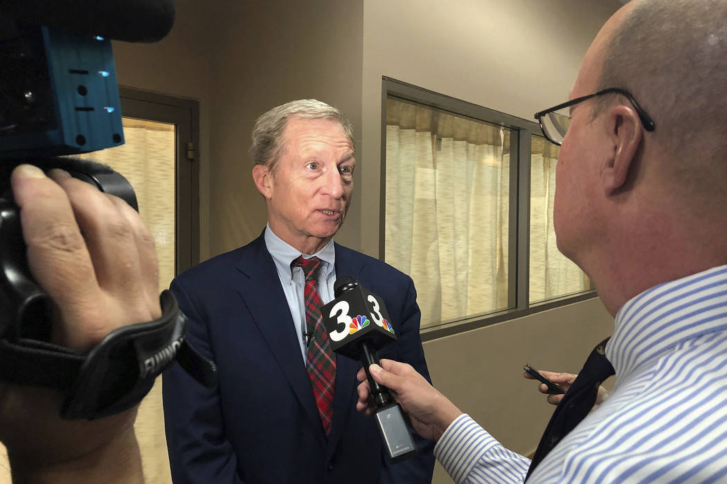 Democratic presidential candidate Tom Steyer speaks to reporters before hosting a town hall in ...