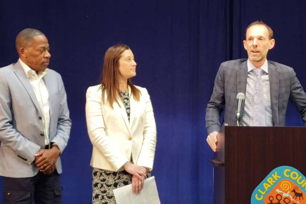 Clark County Commissioner Justin Jones, right, speaks during a press conference Thursday announ ...