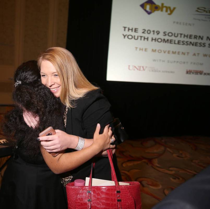 Jessica Halling, program director at St. Jude's Ranch for Children, right, hugs Nevada Partners ...