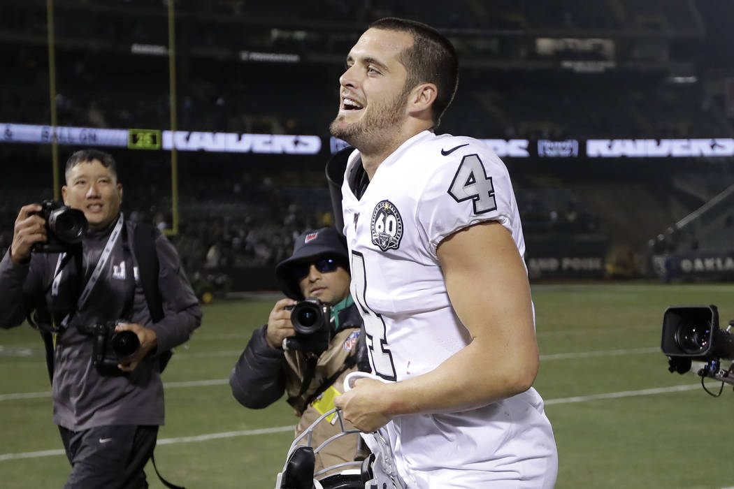 Oakland Raiders quarterback Derek Carr (4) celebrates after the Raiders defeated the Los Angele ...