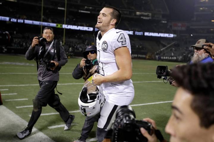 Oakland Raiders quarterback Derek Carr (4) celebrates after the Raiders defeated the Los Angele ...