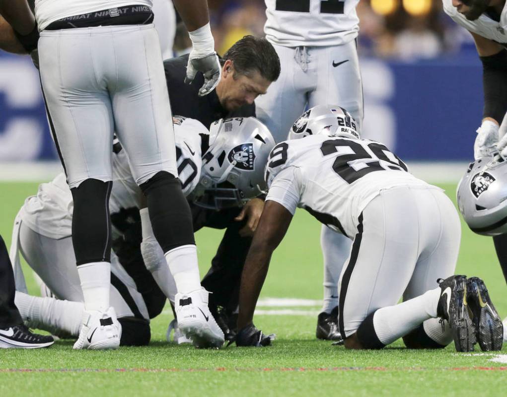 Oakland Raiders cornerback Daryl Worley (20) remains on the field after a play and is checked o ...