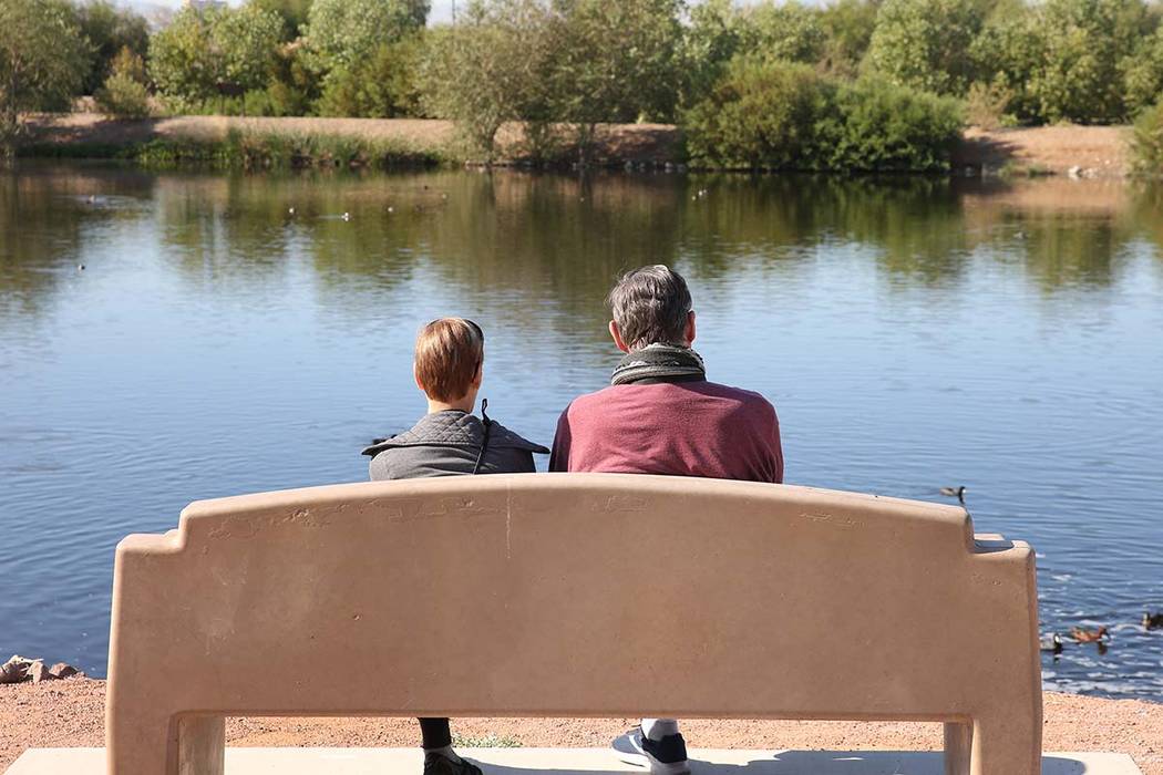 Two people, who declined to give their names, relax at Henderson Bird Viewing Preserve on Thurs ...