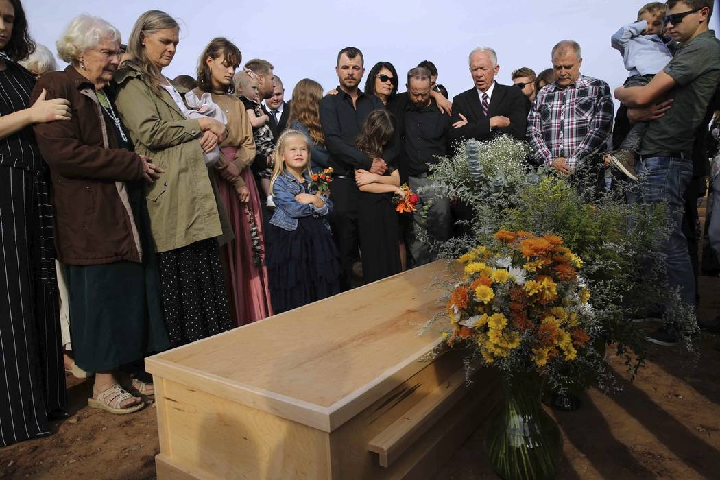 Family and friends attend the burial service of Christina Langford Johnson the last victim of a ...