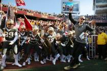 FILE - In this Oct. 26, 2019, file photo, Minnesota head coach P.J. Fleck leads him team on the ...