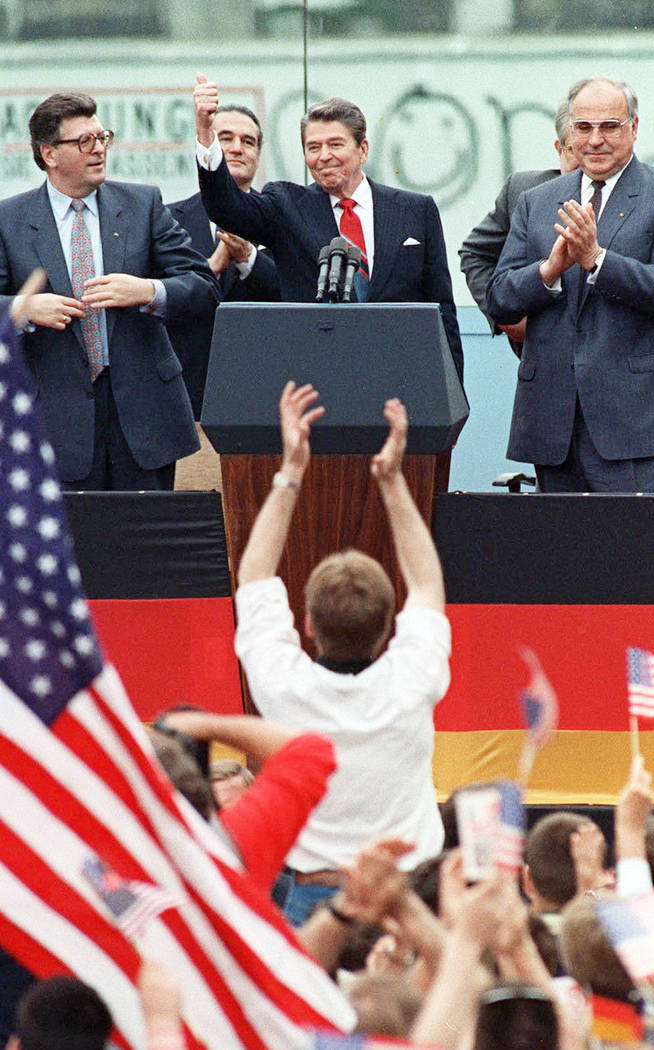 FILE - This Friday, June 12, 1987 file photo shows President Reagan giving a thumbs up sign aft ...