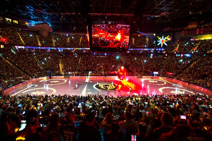 Lighted bracelets twinkle on the wrists of Vegas Golden Knights fans before the start of the fi ...