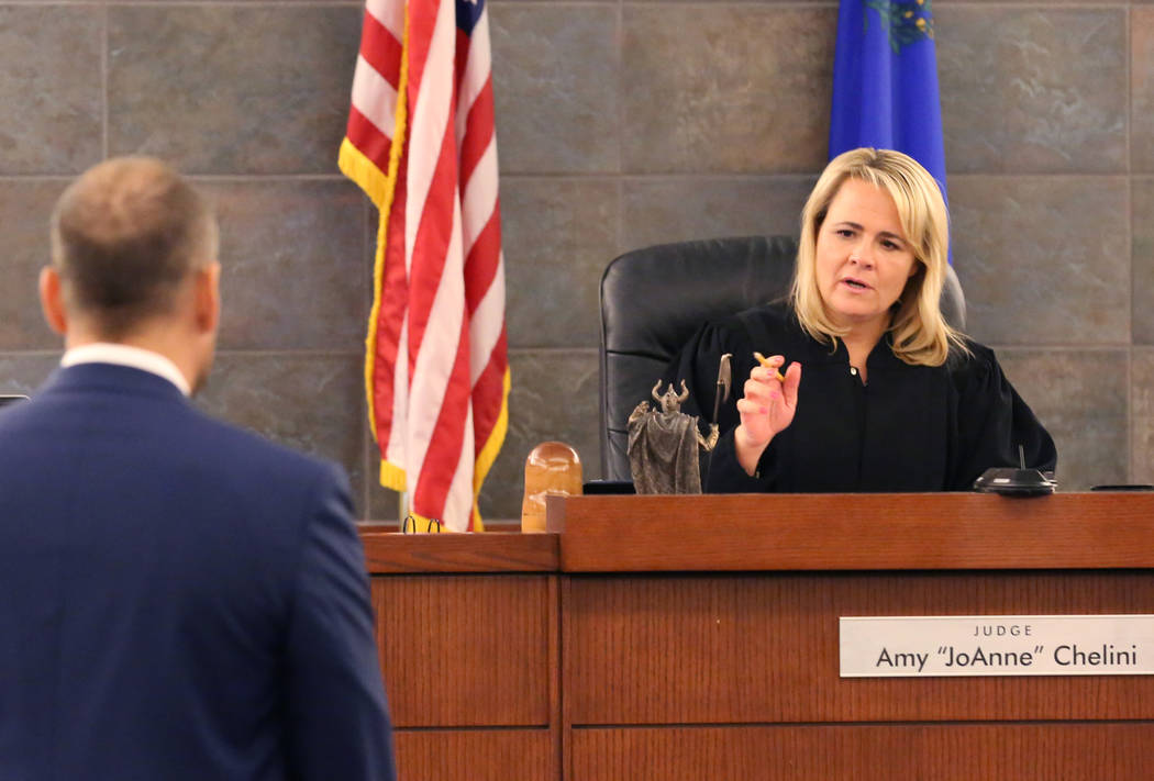 UFC fighter Nick Diaz attorney Ross Goodman, left, listens as Judge Amy "JoAnne'' Chelini speak ...