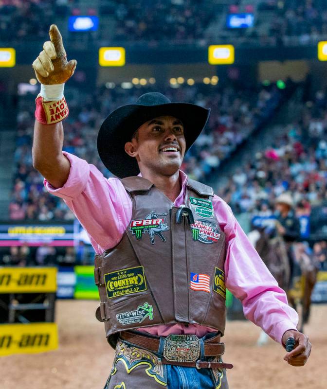 Lucas Davino celebrates a successful ride atop Little Scarfo during the third day of the PBR Wo ...