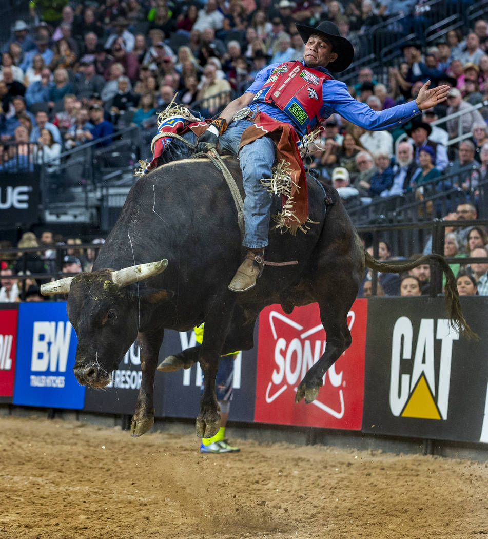 Alisson De Souza leans back on Fly Over during the third day of the PBR World Finals at T-Mobil ...
