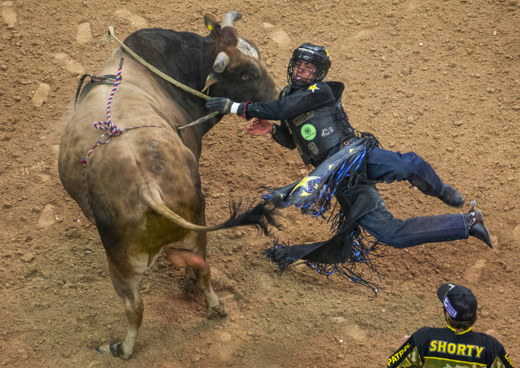 Luciano De Castro falls sideways off of Happy Camper during the third day of the PBR World Fina ...